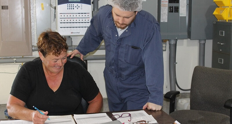 two people looking at paperwork